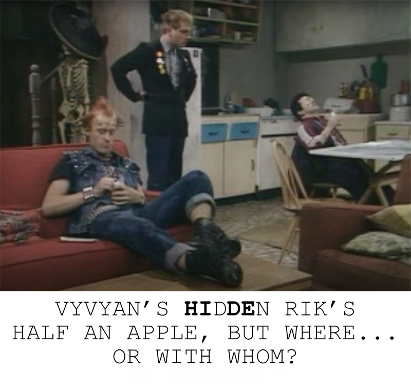 Rik is angry the half of an apple he was saving is missing from their refrigerator. He confronts Mike and Vyvyan about it. Text on the image reads: VYVYAN'S HIDDEN RIK'S HALF AN APPLE, BUT WHERE... OR WITH WHOM?